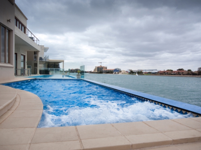 water jets in ground pool overlooking west lakes