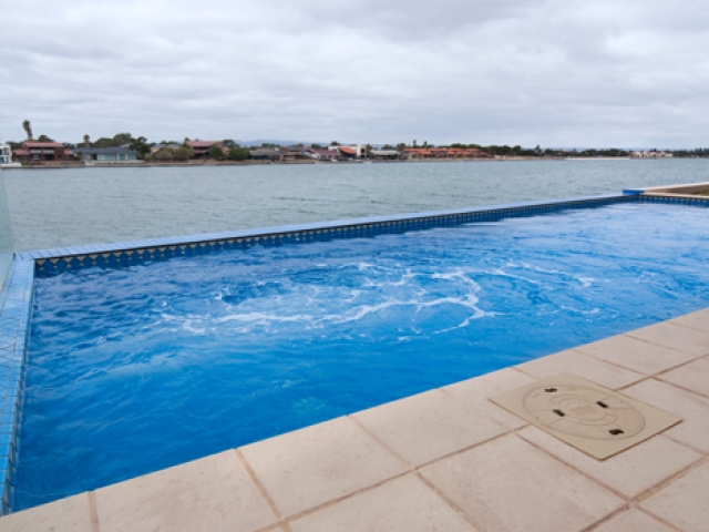 water jets in ground pool overlooking west lakes