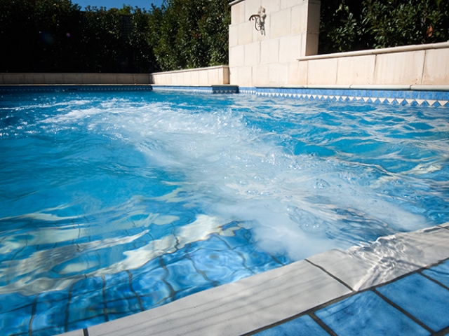 opulent water jet feature installation in ground pool