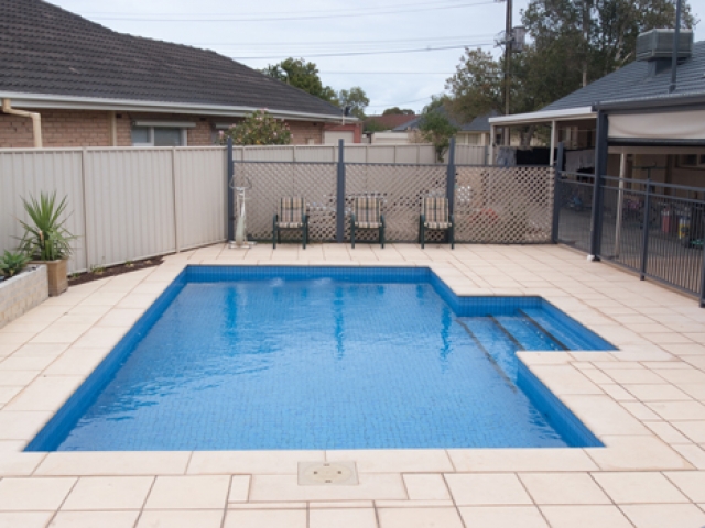 sandstone pavers with overhead verandah and outdoor seating