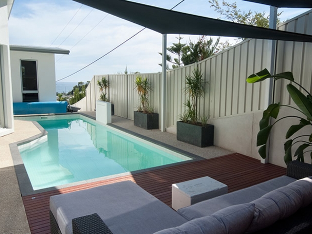 customised in ground pool with elegant outdoor setting